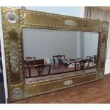 A Brass and metal mounted mirror of rectangular form with a bevelled plate