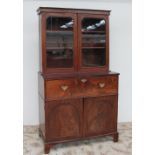 A Victorian mahogany secretaire bookcase, the moulded cornice above a pair of glass doors,