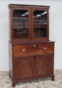 A Victorian mahogany secretaire bookcase, the moulded cornice above a pair of glass doors,