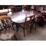 A reproduction mahogany dining table and four chairs ***PLEASE NOTE THAT THIS LOT WILL BE DISPOSED
