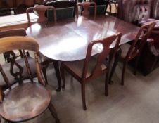 A reproduction mahogany dining table and four chairs ***PLEASE NOTE THAT THIS LOT WILL BE DISPOSED