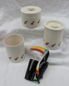 A set of three Carltonware Guiness storage jars together with a Toucan "Guinness for strength"