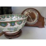 A walnut mantle clock together with an oriental bowl on a stand