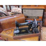 A Cossor Melody Master 523A walnut framed radio together with a Singer sewing machine