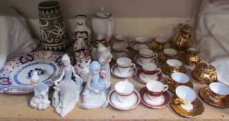 Four Lladro figures together with Masons pottery jugs,