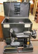 A Singer 222k sewing machine,