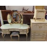 A 20th century cream and gilt decorated dressing table with matching stool,