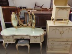 A 20th century cream and gilt decorated dressing table with matching stool,