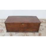 An 18th century oak bible box, the rectangular hinged top enclosing a two division candle box,