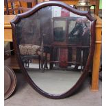 A Shield shaped wall mirror together with three other mirrors