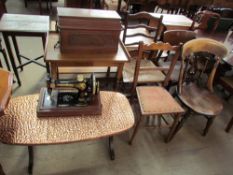 A 20th century copper topped occasional table together with a singer sewing machine,