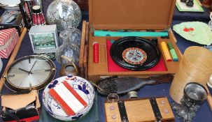 A Roulette game together with a briefcase, decanters, clocks, tie press,