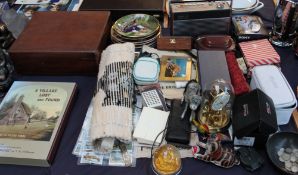 A large lot including a bible, dolls, pottery and other figures, anniversary clock, cigarette cards,