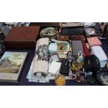 A large lot including a bible, dolls, pottery and other figures, anniversary clock, cigarette cards,