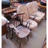 An Ercol two seater settee and armchair together with a pair of elbow chairs