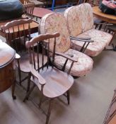 An Ercol two seater settee and armchair together with a pair of elbow chairs