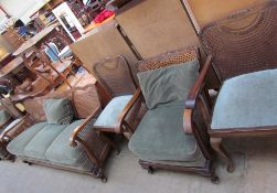 A Bergere three piece suite together with three bergere chairs and a similar table