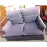 An upholstered two seater settee