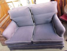 An upholstered two seater settee