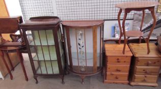 A pair of pine bedside cabinets together with an occasional table, two display cabinets,