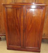 A mahogany side cabinet with a rectangular top above a pair of cupboard doors on a plinth base