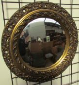 A gilt wall mirror of circular for together with another gilt wall mirror and an oak wall mirror