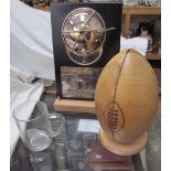 An England Rugby World Champions 2003 trophy together with a tulipwood rugby ball on a maple stand