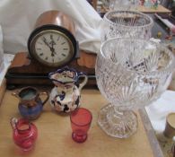 A walnut clock together with glass vases,