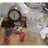 A walnut clock together with glass vases,