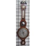 A 19th century mahogany banjo barometer with a hygrometer, alcohol thermometer, convex mirror,