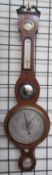 A 19th century mahogany banjo barometer with a hygrometer, alcohol thermometer, convex mirror,