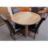 A Modern extending dining table and four chairs