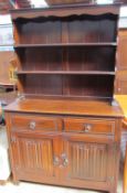 A Jaycee oak dresser, the planked rack with two shelves,