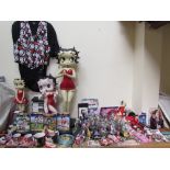 A large collection of Betty Boop memorabilia including figures, mugs, clock.
