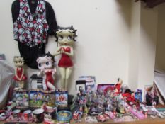 A large collection of Betty Boop memorabilia including figures, mugs, clock.