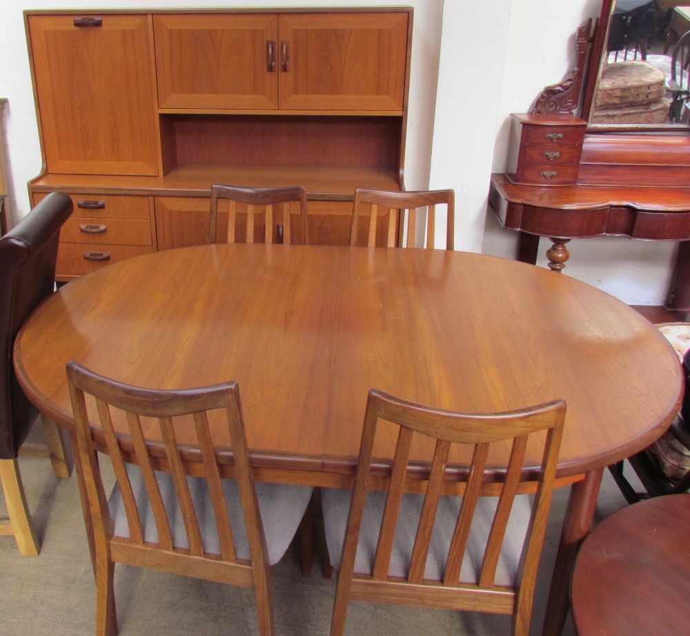 A G-Plan teak sideboard together with a teak extending dining table and four chairs