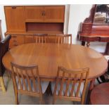 A G-Plan teak sideboard together with a teak extending dining table and four chairs