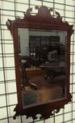 A George III style mahogany wall mirror together with a convex wall mirror and three other mirrors