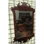 A George III style mahogany wall mirror together with a convex wall mirror and three other mirrors