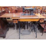 ****WITHDRAWN**** An oak cased Singer sewing machine table with treadle base