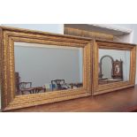 A pair of gilt gesso wall mirrors of rectangular form