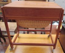 A mid-20th century teak sewing table,