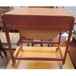 A mid-20th century teak sewing table,
