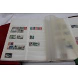 Three stocks books of stamps, including Elizabeth II regionals, world stamps, Postage Due,