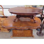 A 20th century walnut extending dining table together with a similar coffee table