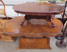 A 20th century walnut extending dining table together with a similar coffee table