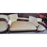 An Edwardian rosewood three piece salon suite comprising a three seater settee and two horseshoe