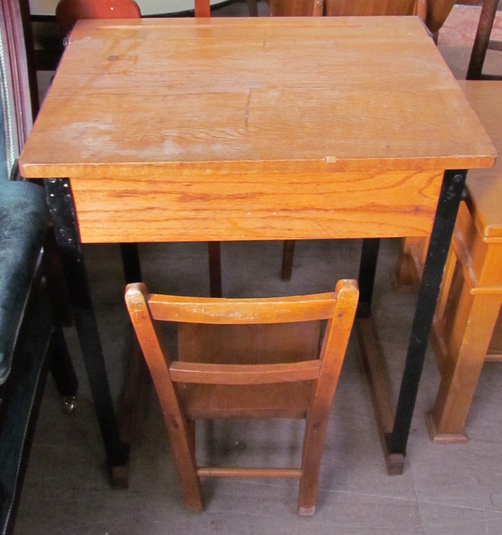 A school desk together with a child's chair