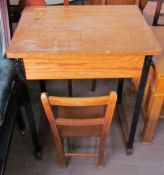 A school desk together with a child's chair