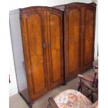 A Butilux walnut four piece bedroom suite comprising two wardrobes,